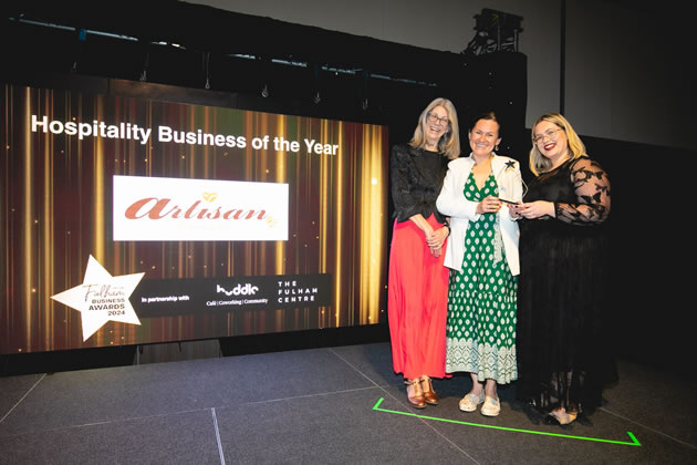 Artisan collects its award for Hospitality Business of the Year 