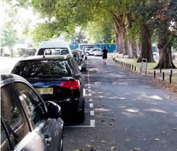 Parked cars in Hurlingham Park in Fulham