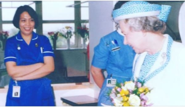 A nurse smiles as she meets the Queen 