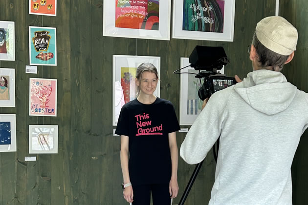 Artist Kelly with her print of her cat Andre which features in This New Ground&rsquo;s new film