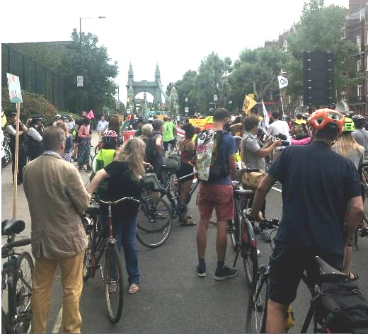 Extinction Rebellion protestors riding from Hammersmith Bridge