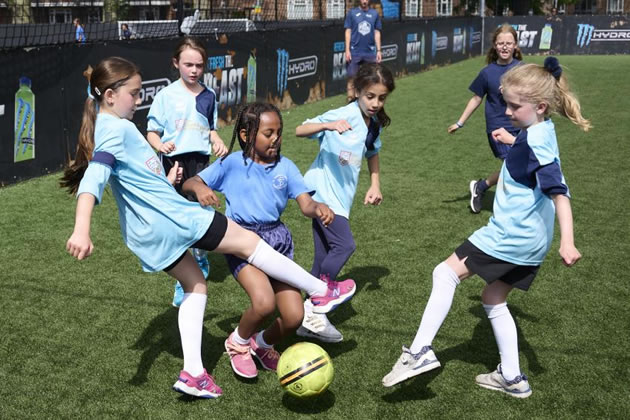Girls playing football in White City