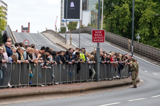 Residents wait next to Hammersmith Flyover
