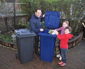 Cllr Bassam Mahfouz with the new bins 